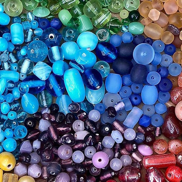 close up of beads in rainbow colors and different shapes